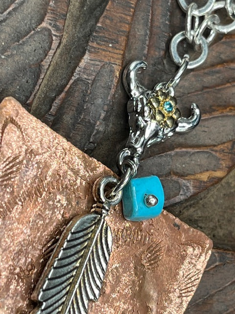 Hand crafted forged copper western cowgirl necklace. 